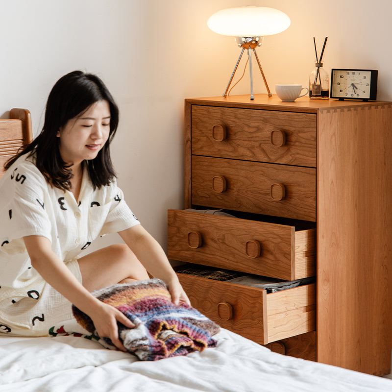 Retro-style solid wood storage cabinet against the wall in the bedroom